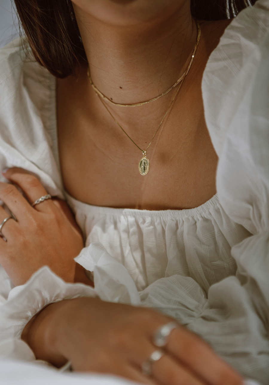 Summer Jewelry Stack Guide A stylish collection of layered and mixed jewelry pieces, including bracelets, necklaces, and rings, perfect for creating a unique summer jewelry stack.